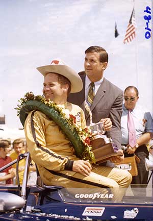 Mark Donohue celebrates the first-ever INDYCAR win for Team Penske